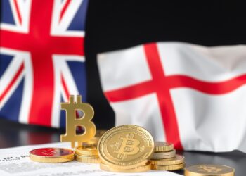 US and UK flags with digital stablecoin coins representing joint financial regulation talks