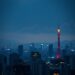 Rising Japanese government bond yields over Tokyo skyline
