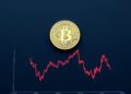 Bitcoin coin above a declining US Treasury bond yield chart