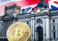 Bitcoin coin beside a government building and UK flag representing crypto regulation